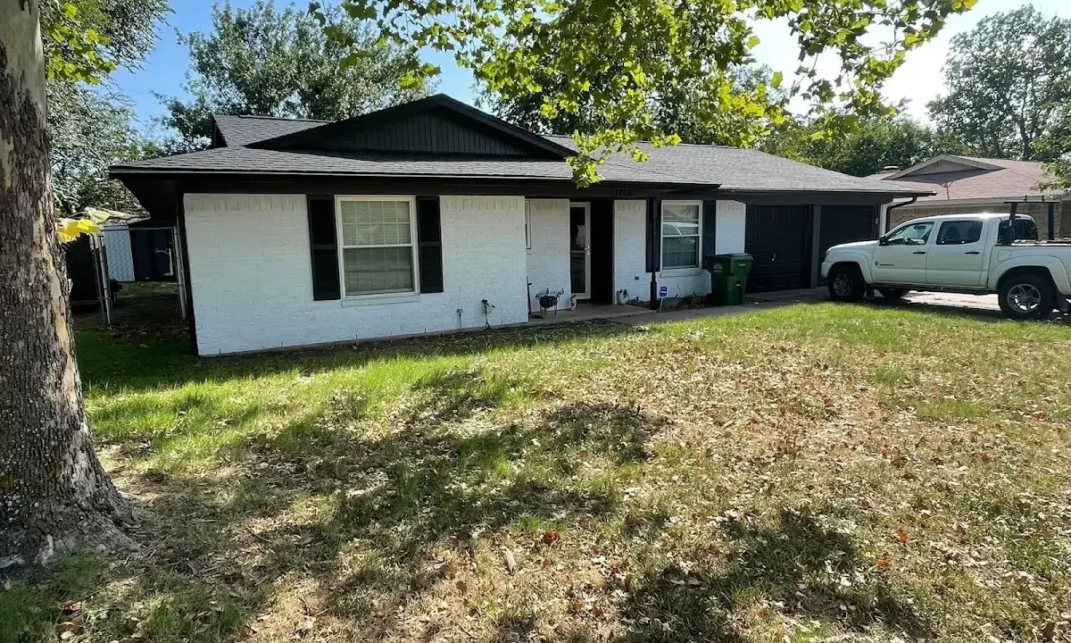 Professional roofing crew working on a residential roof in Morris